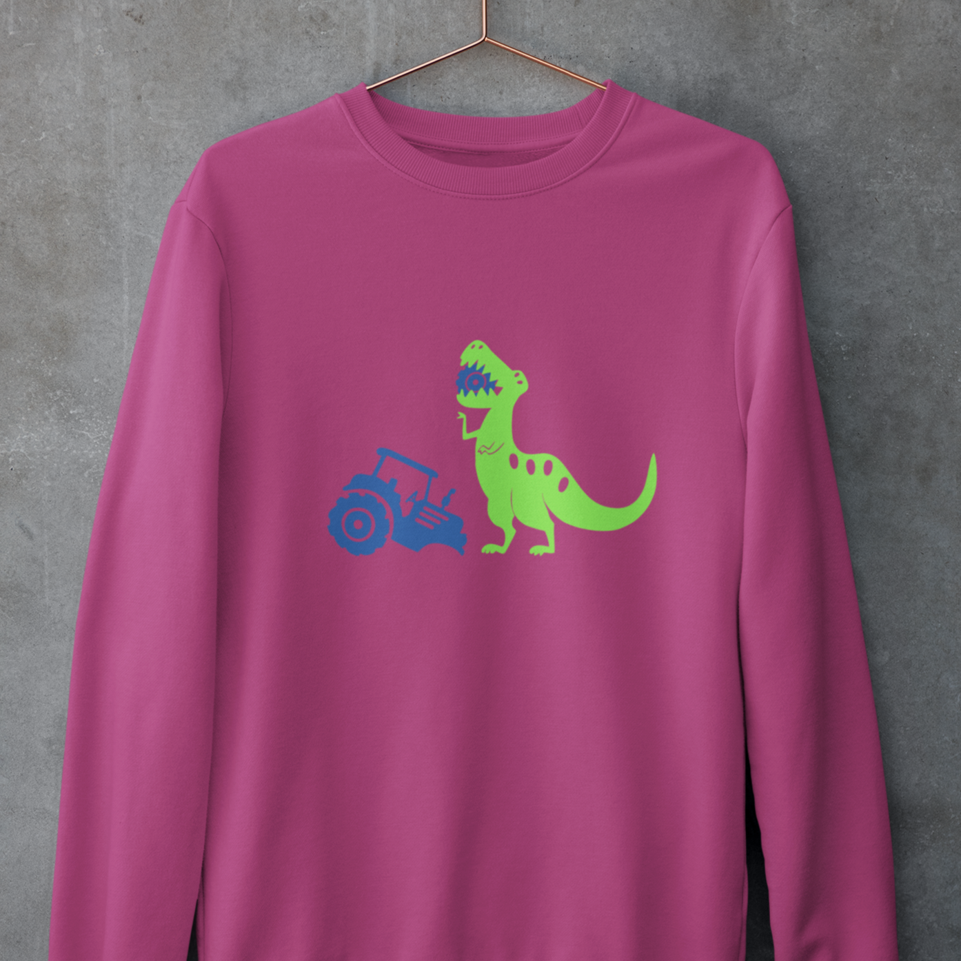 Orchid pink sweatshirt with neon green tractor eating dinosaur